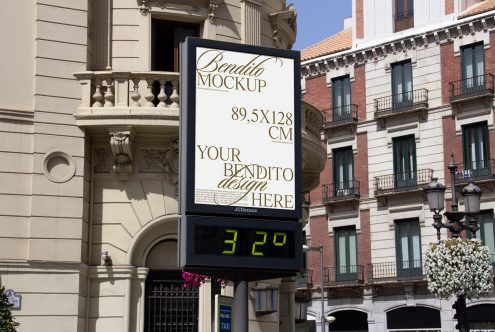 Outdoor billboard mockup on city street corner for advertising designs, showcasing urban environment with clear space for graphic display.