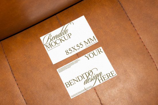 Elegant business card mockup on brown leather surface for showcasing design portfolio, ideal for graphic designers and branding projects.
