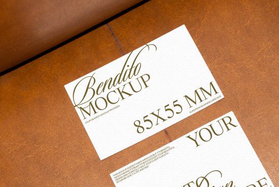 Business card mockup on a leather surface for designers to display card designs, showcasing elegant script font, size specification, and branding.