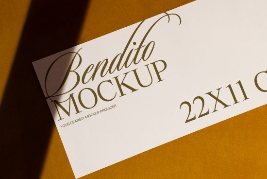 Elegant paper mockup with cursive font showcasing Bendito Mockup on a white sheet with shadow over a brown background, perfect for design presentations.