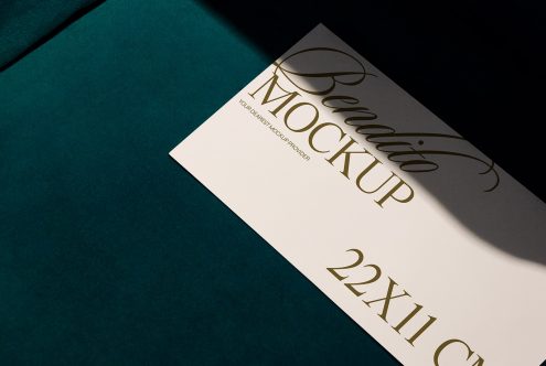 Elegant card mockup on dark green surface with stylish gold font showcasing design, perfect for presentations, digital assets marketplace.