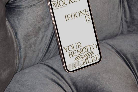 Smartphone on grey fabric showcasing screen mockup for iPhone 13, ideal for presenting app designs, display graphics, or web templates.