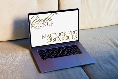 Laptop on textured background displaying high-resolution screen mockup for design presentation, ideal for digital asset marketplace.