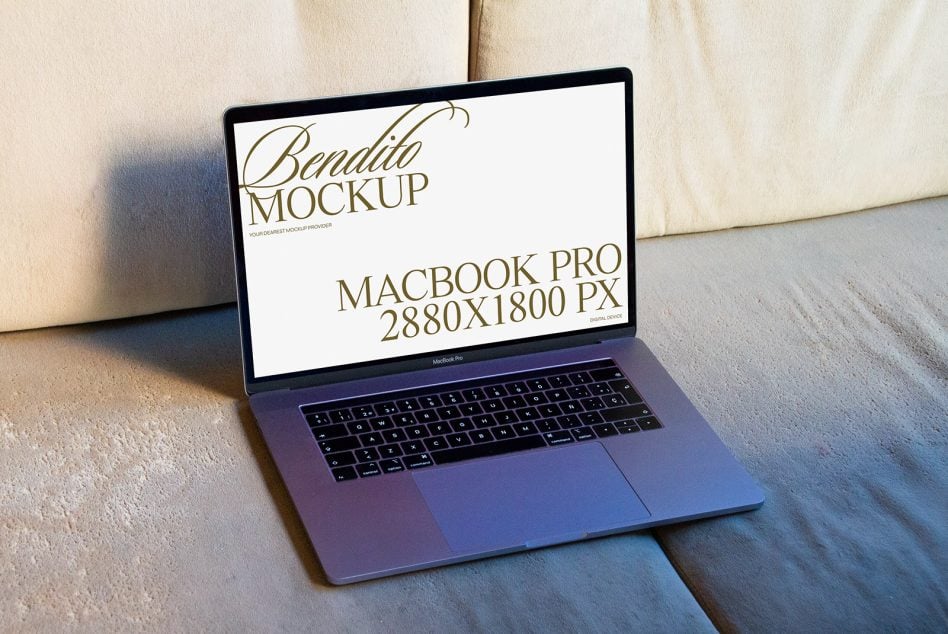 MacBook Pro on beige linen fabric with soft afternoon sunlight