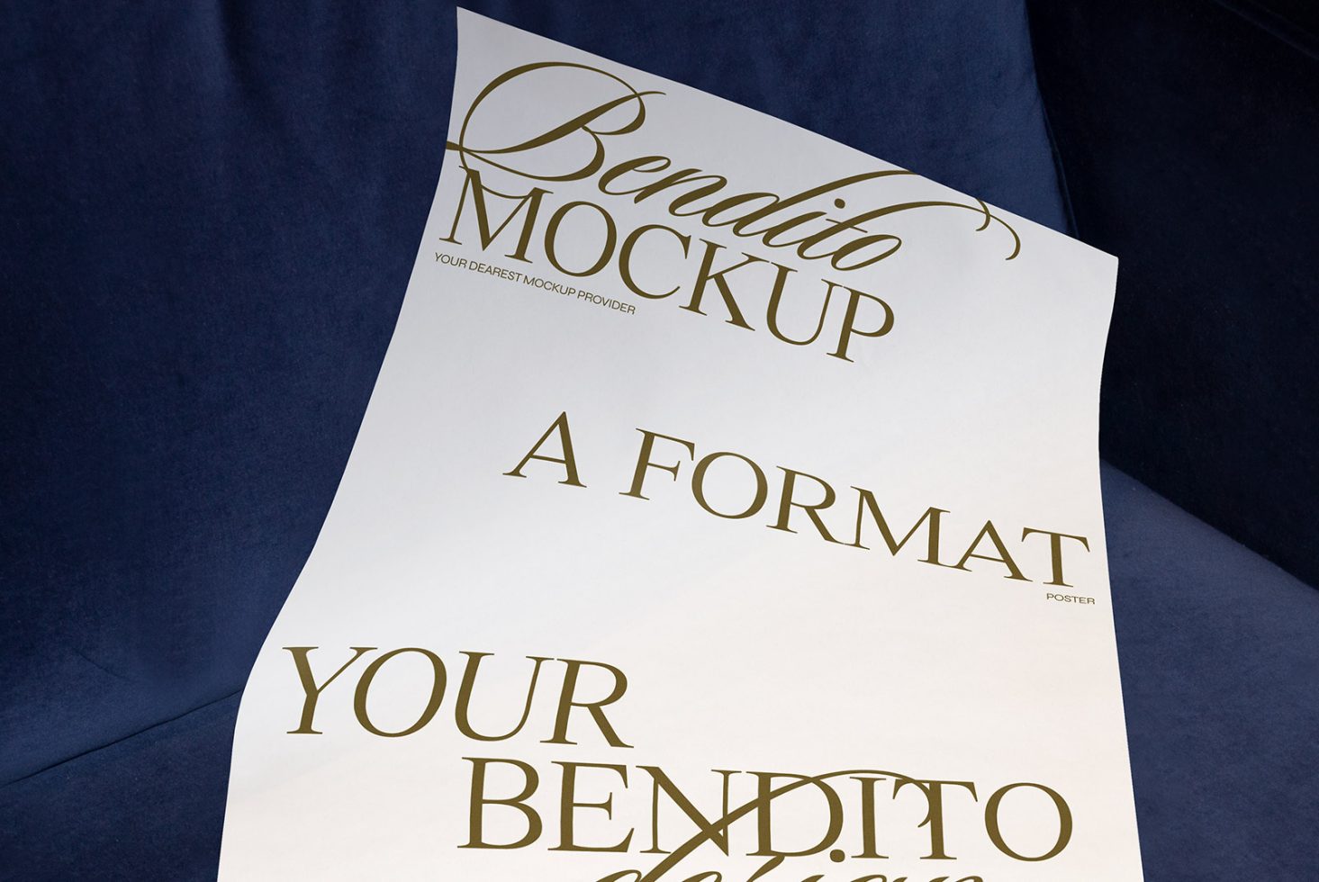 Elegant A format poster mockup with gold typography on white paper, leaned against a dark blue sofa, ideal for design presentations.