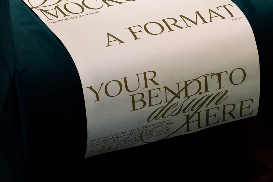 Close-up of rolled poster mockup showing gold serif text on cream paper