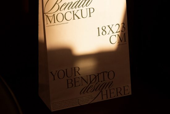 Elegant paper bag mockup with customizable design space, standing in a dimly lit environment, showcasing size details for designers.