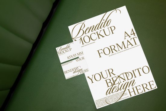Elegant business card and A4 mockup on green leather surface for design presentation, featuring customizable design insert areas.
