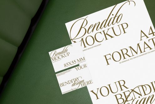 Elegant business card and stationery mockup on green leather background, showcasing font and design space. Perfect for designers and Mockups category.