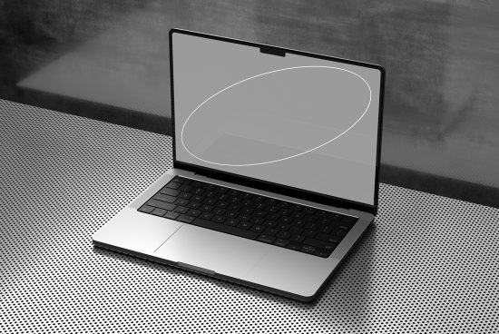 Modern laptop mockup on dotted surface with shadow, ideal for digital design presentations and web templates.