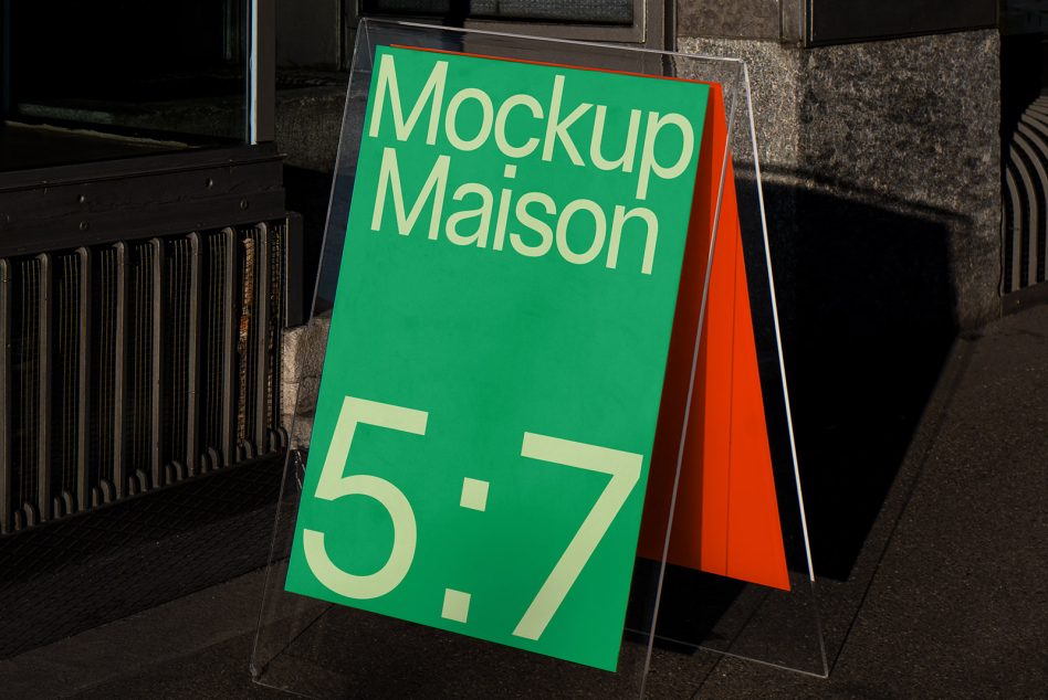 Outdoor advertising mockup displayed on a sidewalk with a green and orange design, clear visibility in urban setting, perfect for designers.