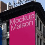 Urban billboard mockup on a city building corner for outdoor advertising design presentations, with clear sky background.