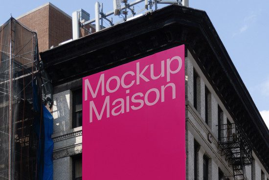 Urban billboard mockup on a city building corner for outdoor advertising design presentations, with clear sky background.