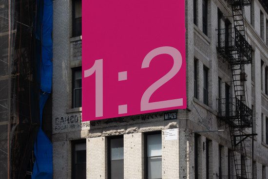 Urban billboard mockup with pink design and bold typography ratio 1:2 for outdoor advertising, cityscape background, designers asset.