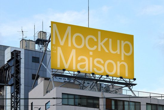 Billboard mockup on urban building exterior for advertising design presentation, clear sky, realistic cityscape setting.