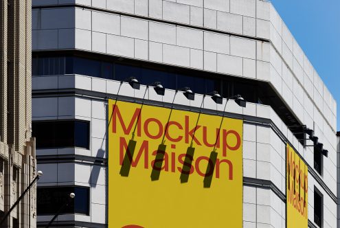 Urban building mockup example with bold yellow sign for outdoor advertising and design showcase, clear sky, modern cityscape.