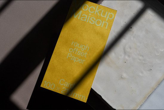 Yellow paper mockup with shadow overlay, showcasing rough offset paper texture for realistic design presentation, ideal for graphics and templates.