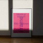 Modern poster frame mockup standing on wooden floor against white wall with shadows, realistic template for designers.