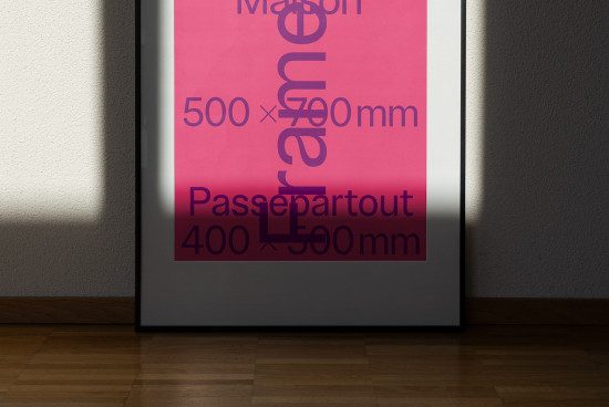 Minimalist poster frame mockup with shadows on white wall, showcasing modern design, suitable for graphic display presentation.