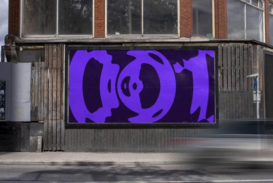 Street-level billboard mockup with vibrant purple abstract graphics, showcasing urban advertising potential for designers.