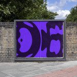 Urban billboard mockup with a vibrant purple abstract design poster on a brick wall, clear day, for outdoor advertising graphic display.