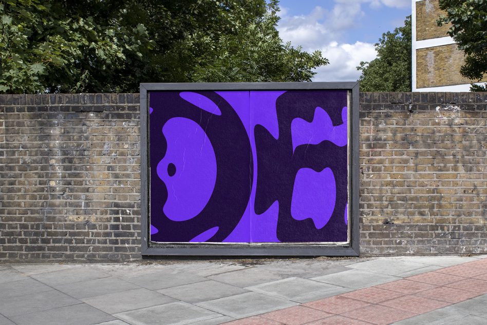 Urban billboard mockup with a vibrant purple abstract design poster on a brick wall, clear day, for outdoor advertising graphic display.