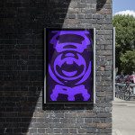 Vibrant purple poster design mockup displayed on urban brick wall, graphic template, modern street style, clear sunny day, outdoor billboard presentation.
