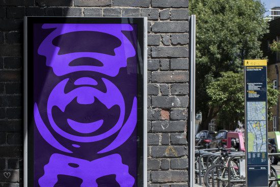 Street poster mockup featuring purple abstract art on display in an urban setting, ideal for designers to showcase advertising designs.