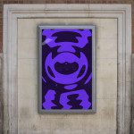 Urban poster mockup on a brick wall displaying abstract purple design, ideal for presentations and portfolios in graphic design.