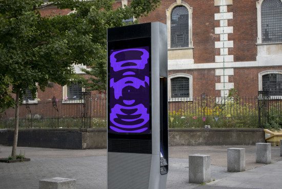 Outdoor advertising digital kiosk mockup with bold graphic design displayed in an urban setting, perfect for showcasing signage designs.