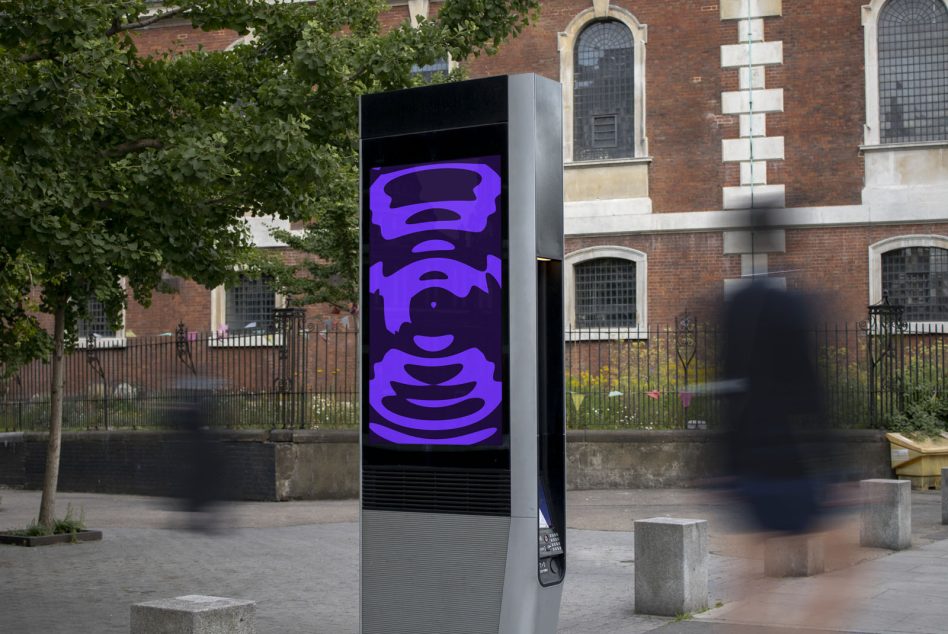 Digital kiosk mockup displaying purple abstract graphics in an urban setting, with blurred pedestrian movement. Perfect for designers' advertising mockups.