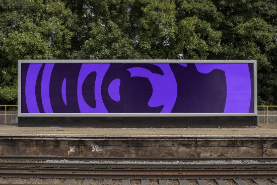 Outdoor billboard mockup with abstract purple graphics displayed at a train station, ideal for showcasing advertising designs.