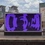 Urban billboard mockup featuring a purple abstract design with city buildings in the background, suitable for graphic and advertisement showcase.