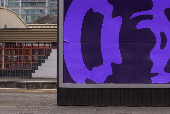 Urban billboard mockup with abstract purple graphic design poster, in a realistic outdoor setting for presentation.