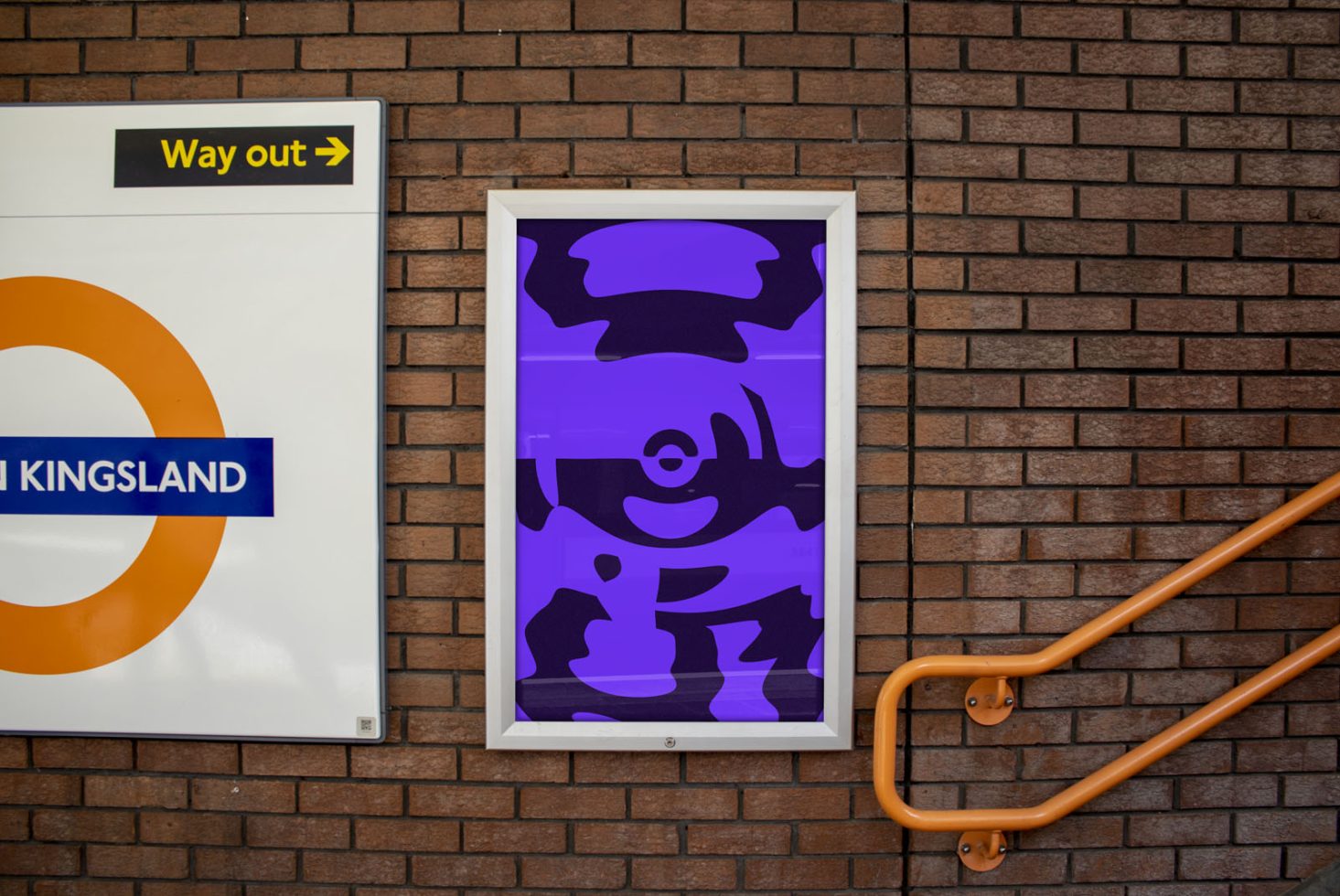 Urban poster mockup in a frame on a brick wall by a staircase, with dynamic purple abstract art, showcasing design mockup potential.