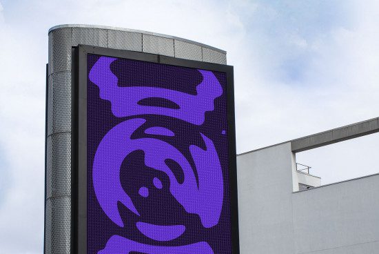Urban digital billboard mockup on building with abstract purple graphic design, clear skies, for advertising display templates.