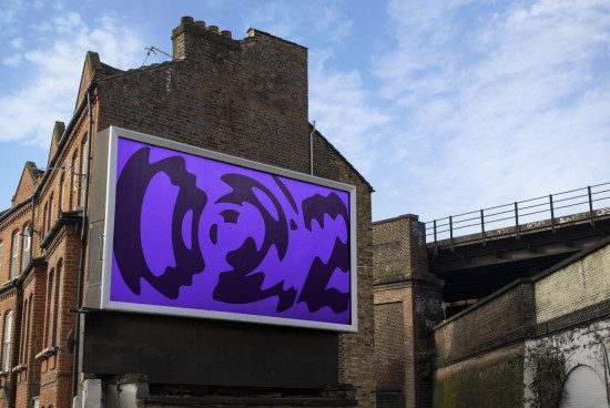 Urban billboard mockup with abstract purple graphic design, clear sky, old buildings and bridge, ideal for outdoor advertising presentation.