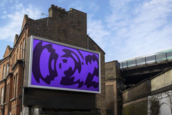 Billboard mockup with abstract purple graphics on urban building backdrop, clear sky, passing train, suitable for outdoor advertising design display.