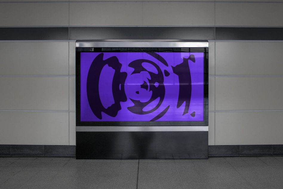 Modern storefront display showing purple graphic on black panel