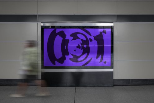 Billboard mockup in a subway station with abstract purple graphic, featuring a motion-blurred pedestrian, ideal for advertising designs display.