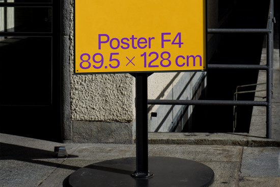 Urban outdoor poster mockup on stand with yellow background displaying dimensions 89.5x128 cm for designers' presentations.