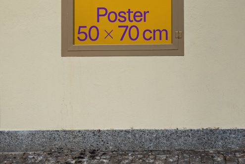 Wall-mounted poster mockup in urban setting, 50x70 cm size indicator, visible frame, ideal for outdoor advertising design preview.