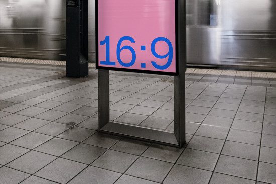 Digital billboard mockup in subway station with a 16:9 aspect ratio screen, ideal for advertising and graphic design presentations.