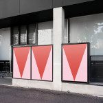 Urban outdoor poster mockup on a modern building's facade, showcasing bold geometric graphics for impactful advertising designs.