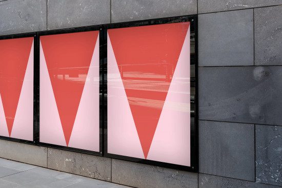 Storefront window poster mockup with red and white geometric design, ideal for showcasing graphics and advertising in an urban setting.