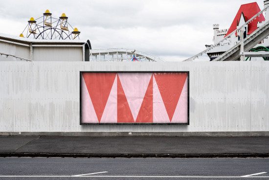 Outdoor billboard mockup with red geometric design on urban roadside, suitable for display advertising graphics and branding presentation.