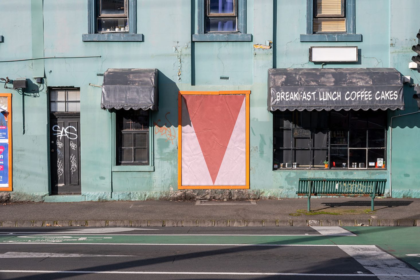 Urban cafe exterior with geometric mockup poster, weathered architecture, vintage signage for design templates.