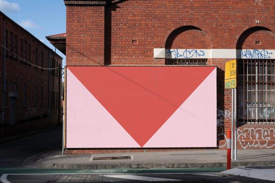 Urban billboard mockup on a brick wall with shadow, perfect for street advertising poster design presentations.