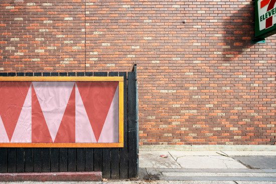 Urban brick wall texture with graphic poster mockup for design presentation, ideal for backgrounds and urban templates.