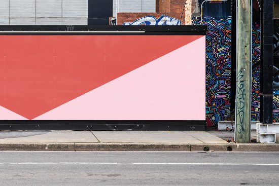 Urban billboard mockup with blank space for design assets presentation, contrasting street art for urban designs. Ideal for graphic templates display.